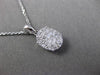 ESTATE .40CT DIAMOND 18KT WHITE GOLD FLOATING CLUSTER FILIGREE OVAL PENDANT