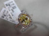 ESTATE 1.32CT GIA FANCY YELLOW DIAMOND 18KT WHITE GOLD OVAL HALO ENGAGEMENT RING