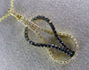 ESTATE .38CT WHITE & BLACK DIAMOND 14K YELLOW GOLD 3D INFINITY LOVE KNOT PENDANT
