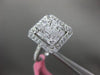 ESTATE LARGE .82CT ROUND & BAGUETTE DIAMOND 18KT WHITE GOLD HALO ENGAGEMENT RING