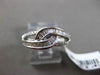 ESTATE WIDE .34CT BAGUETTE & ROUND DIAMOND 18KT WHITE GOLD 3D INFINITY LOVE RING