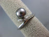 ESTATE .05CT ROUND DIAMOND & AAA TAHITIAN PEARL 18KT WHITE GOLD SWIRL LOVE RING