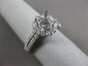 ESTATE .69CT DIAMOND 14KT WHITE GOLD FOUR PRONG HALO SEMI MOUNT ENGAGEMENT RING
