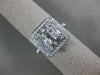 ESTATE LARGE .82CT ROUND & BAGUETTE DIAMOND 18KT WHITE GOLD HALO ENGAGEMENT RING