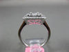 ESTATE LARGE .82CT ROUND & BAGUETTE DIAMOND 18KT WHITE GOLD HALO ENGAGEMENT RING