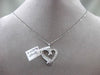 ESTATE .29CT ROUND & BAGUETTE DIAMOND 14K WHITE GOLD FLOATING LOVE HEART PENDANT