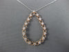 .48CT DIAMOND 14KT WHITE AND ROSE GOLD 3D OPEN TEAR DROP FLOATING LOVE PENDANT