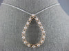 .48CT DIAMOND 14KT WHITE AND ROSE GOLD 3D OPEN TEAR DROP FLOATING LOVE PENDANT