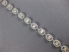 ESTATE 3.73CT DIAMOND 18KT WHITE GOLD 3D INVISIBLE OVAL CLASSIC TENNIS BRACELET