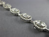 ESTATE 3.73CT DIAMOND 18KT WHITE GOLD 3D INVISIBLE OVAL CLASSIC TENNIS BRACELET