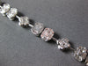 3.98CT DIAMOND 18KT WHITE GOLD INVISIBLE FLOWER OVAL BY THE YARD TENNIS BRACELET