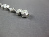3.98CT DIAMOND 18KT WHITE GOLD INVISIBLE FLOWER OVAL BY THE YARD TENNIS BRACELET