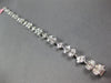 3.98CT DIAMOND 18KT WHITE GOLD INVISIBLE FLOWER OVAL BY THE YARD TENNIS BRACELET