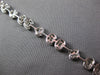 3.98CT DIAMOND 18KT WHITE GOLD INVISIBLE FLOWER OVAL BY THE YARD TENNIS BRACELET