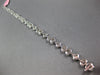3.98CT DIAMOND 18KT WHITE GOLD INVISIBLE FLOWER OVAL BY THE YARD TENNIS BRACELET