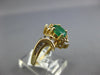 .68CT DIAMOND & AAA EMERALD 14KT YELLOW GOLD OVAL & ROUND FLOWER SWIRL FUN RING