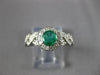 ESTATE .70CT DIAMOND & AAA EMERALD 14KT WHITE GOLD ROUND HALO INFINITY LOVE RING
