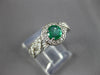ESTATE .70CT DIAMOND & AAA EMERALD 14KT WHITE GOLD ROUND HALO INFINITY LOVE RING