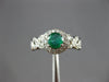ESTATE .70CT DIAMOND & AAA EMERALD 14KT WHITE GOLD ROUND HALO INFINITY LOVE RING