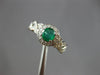 ESTATE .70CT DIAMOND & AAA EMERALD 14KT WHITE GOLD ROUND HALO INFINITY LOVE RING