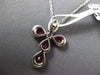 1.17CT DIAMOND & RUBY 18KT WHITE GOLD ROUND & PEAR SHAPE CROSS FLOATING PENDANT