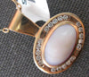 LARGE .46CT DIAMOND & AAA MOTHER OF PEARL 18KT ROSE GOLD SIDEWAYS OVAL PENDANT