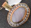 LARGE .89CT DIAMOND & AAA MOTHER OF PEARL 18KT ROSE GOLD SIDEWAYS OVAL PENDANT