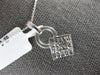 .81CT DIAMOND 14KT WHITE GOLD ROUND & PRINCESS INVISIBLE SQUARE FLOATING PENDANT