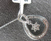 .52CT DIAMOND 18KT WHITE GOLD ROUND & BAGUETTE FLOWER TEAR DROP FLOATING PENDANT