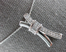.30CT DIAMOND 14KT WHITE GOLD ROUND & PRINCESS INVISIBLE X LOVE FLOATING PENDANT
