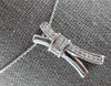 .30CT DIAMOND 14KT WHITE GOLD ROUND & PRINCESS INVISIBLE X LOVE FLOATING PENDANT