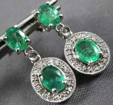 .65CT DIAMOND & AAA EMERALD 14KT WHITE GOLD OVAL & ROUND FLOWER HANGING EARRINGS