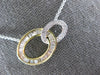 .54CT DIAMOND 14KT 2 TONE GOLD 3D ROUND & BAGUETTE DOUBLE OVAL LOVE KNOT PENDANT