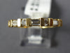 ESTATE .58CT DIAMOND 14KT YELLOW GOLD ROUND & BAGUETTE CHANNEL ANNIVERSARY RING