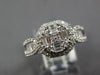 1.40CT DIAMOND 18KT WHITE GOLD 3D ROUND & BAGUETTE INVISIBLE OCTAGON FLOWER RING