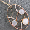 ESTATE LARGE .33CT DIAMOND & AAA MOTHER OF PEARL 14KT ROSE GOLD OVAL FUN PENDANT