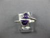 .70CT DIAMOND & AAA AMETHYST 14KT WHITE GOLD TRILLION & ROUND CRISS CROSS RING