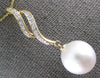 LARGE .12CT DIAMOND & AAA SOUTH SEA PEARL 14KT YELLOW GOLD DOUBLE SWIRL PENDANT