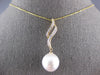 LARGE .12CT DIAMOND & AAA SOUTH SEA PEARL 14KT YELLOW GOLD DOUBLE SWIRL PENDANT