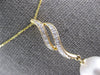 LARGE .12CT DIAMOND & AAA SOUTH SEA PEARL 14KT YELLOW GOLD DOUBLE SWIRL PENDANT