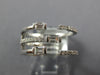 WIDE .47CT DIAMOND 18KT WHITE GOLD ROUND & BAGUETTE CRISS CROSS TENSION FUN RING