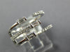 WIDE .47CT DIAMOND 18KT WHITE GOLD ROUND & BAGUETTE CRISS CROSS TENSION FUN RING