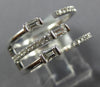 WIDE .47CT DIAMOND 18KT WHITE GOLD ROUND & BAGUETTE CRISS CROSS TENSION FUN RING