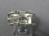 WIDE .47CT DIAMOND 18KT WHITE GOLD ROUND & BAGUETTE CRISS CROSS TENSION FUN RING