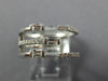 WIDE .47CT DIAMOND 18KT WHITE GOLD ROUND & BAGUETTE CRISS CROSS TENSION FUN RING