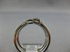 WIDE .47CT DIAMOND 18KT WHITE GOLD ROUND & BAGUETTE CRISS CROSS TENSION FUN RING