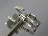 WIDE .47CT DIAMOND 18KT WHITE GOLD ROUND & BAGUETTE CRISS CROSS TENSION FUN RING