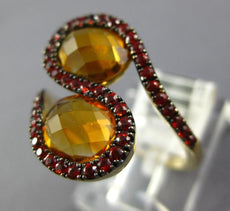 6.69CT CITRINE & ORANGE SAPPHIRE 14KT YELLOW GOLD OVAL & ROUND CRISS CROSS RING