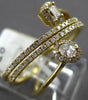 .50CT DIAMOND 18KT YELLOW GOLD ROUND BAGUETTE & OVAL MULTI ROW CRISS CROSS RING