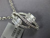 .73CT DIAMOND 18KT WHITE GOLD ROUND & BAGUETTE DOUBLE LEAF INFINITY LOVE PENDANT